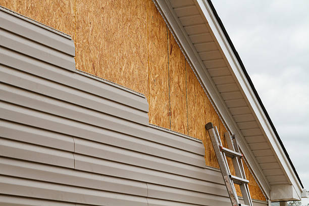 Professional Storm Damage Siding Repair technician working in Montgomery, PA